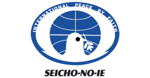 Logotipo da Seicho-No-Ie com a representação do globo terrestre ao fundo com uma silhueta de pombo a frente.